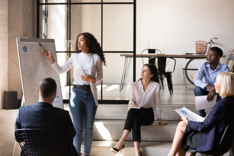 African businesswoman manager give presentation on whiteboard at office ...